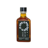 Perilla oil bottle with amber glass, metal cap, and label with circular emblem