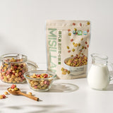 Organic cereal bag with glass jars of colorful rice and vegetable puffs and milk jug