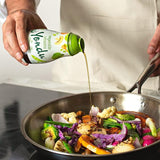 Yondu vegetable umami seasoning sauce bottle pouring into skillet