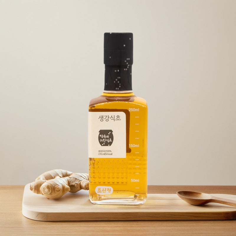 Ginger vinegar bottle with amber liquid, dropper cap, and measurement markings