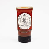 Five Grain Syrup squeeze bottle with amber red syrup and screw cap