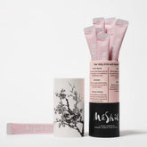MeShil organic Korean plum extract pouches, pink foil sachets with flip-top ends