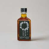Amber glass perilla oil bottle with dark metal cap, 200 ml