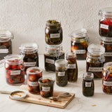 Jang cookbook page showing assorted preserved food in clear jars on a tray