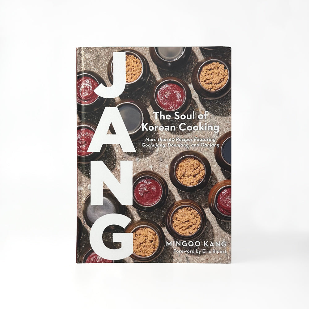 Jang cookbook cover with 'JANG' lettering and bowl ingredient collage
