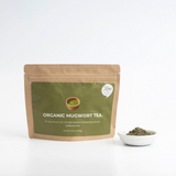 Organic mugwort powder (100 g) pouch with white bowl of dark green powder