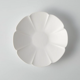 White round flower plate with segmented petal design