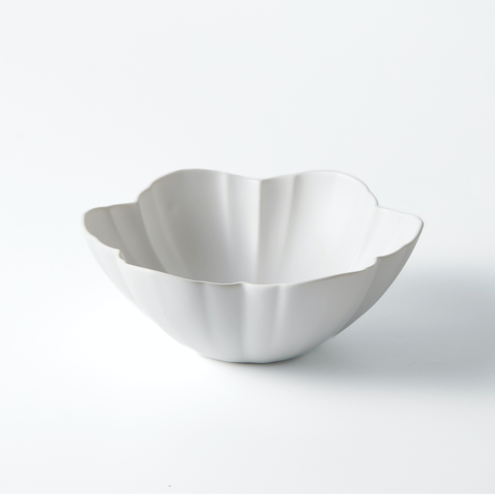 White round fluted bowl with flower petal shape and curved rim