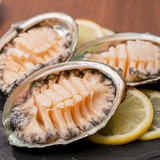 Abalone shells filled with sliced meat