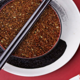 Organic red rice in a bowl, shown as cooked grains
