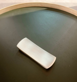 Bronzeware cutlery rest, rectangular with rounded ends, brushed metallic finish