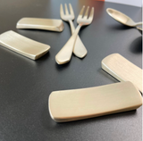 Bronzeware cutlery rest set, curved rectangular pieces with fork and spoon