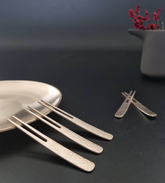 Bronze dessert forks with textured handles, small four-tine tips