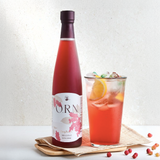 Omija extract 500ml bottle with amber drink in a glass