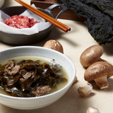 Sea mustard soup in a bowl with visible dark seaweed strips