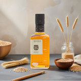 Brown rice vinegar bottle with amber liquid and front label, 250 ml