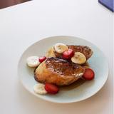 Round serving plate, light blue with plated chicken and fruit