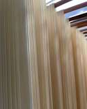 Potato noodles packaged bundle with light-colored, flat contents