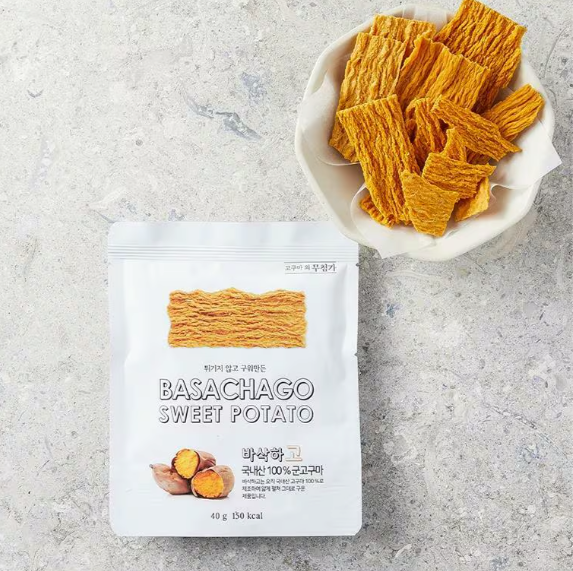 Sweet potato chips in bowl with sealed snack pouch, orange dried strips