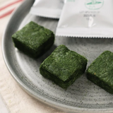 Maesaengi green square cubes on a metal tray
