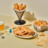Plate of fried fish chips with crinkle-cut pieces and stacked cones