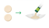 Vegetable stock powder stick sachet pouring granules into a bowl