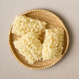 Dried rice noodle strands for kalguksu in a round woven basket