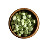 Chopped Cheongyang chili pepper pieces in a wooden bowl, pale green