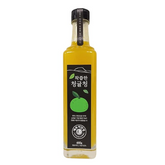 Jeju green tangerine extract bottle with black cap, filled with yellow liquid