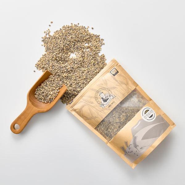 Bagged barley rice grains with wooden serving scoop