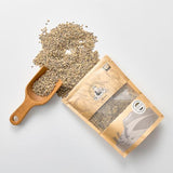 Bagged barley rice grains with wooden serving scoop