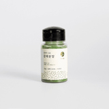 Powder jar with black lid and light green label, 20 g