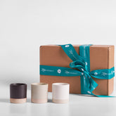 Shot cup gift set with three cups in dark, beige, and white; includes brown gift box