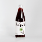 Organic Korean plum extract drink bottle with MeShil label, clear cap, dark liquid