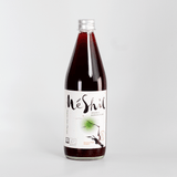 Organic Korean plum extract drink bottle with MeShil label, clear cap, dark liquid