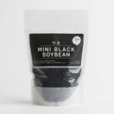 Mini black soybeans pouch with black bean kernels visible through clear window