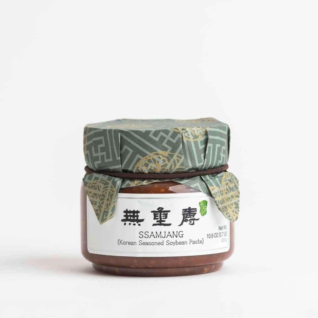 Jar of ssamjang paste with patterned cloth lid and label
