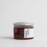 Grilled cutlassfish with ssamjang jar, dark brown paste in clear plastic container