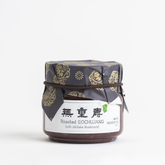 Gochujang mushroom stir-fry jar with floral lid and printed label
