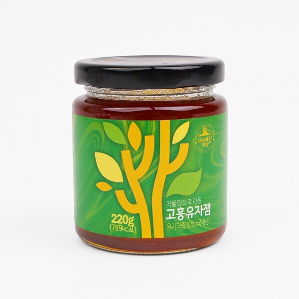 Sweet potato fruit jam jar with amber-brown jam and black lid