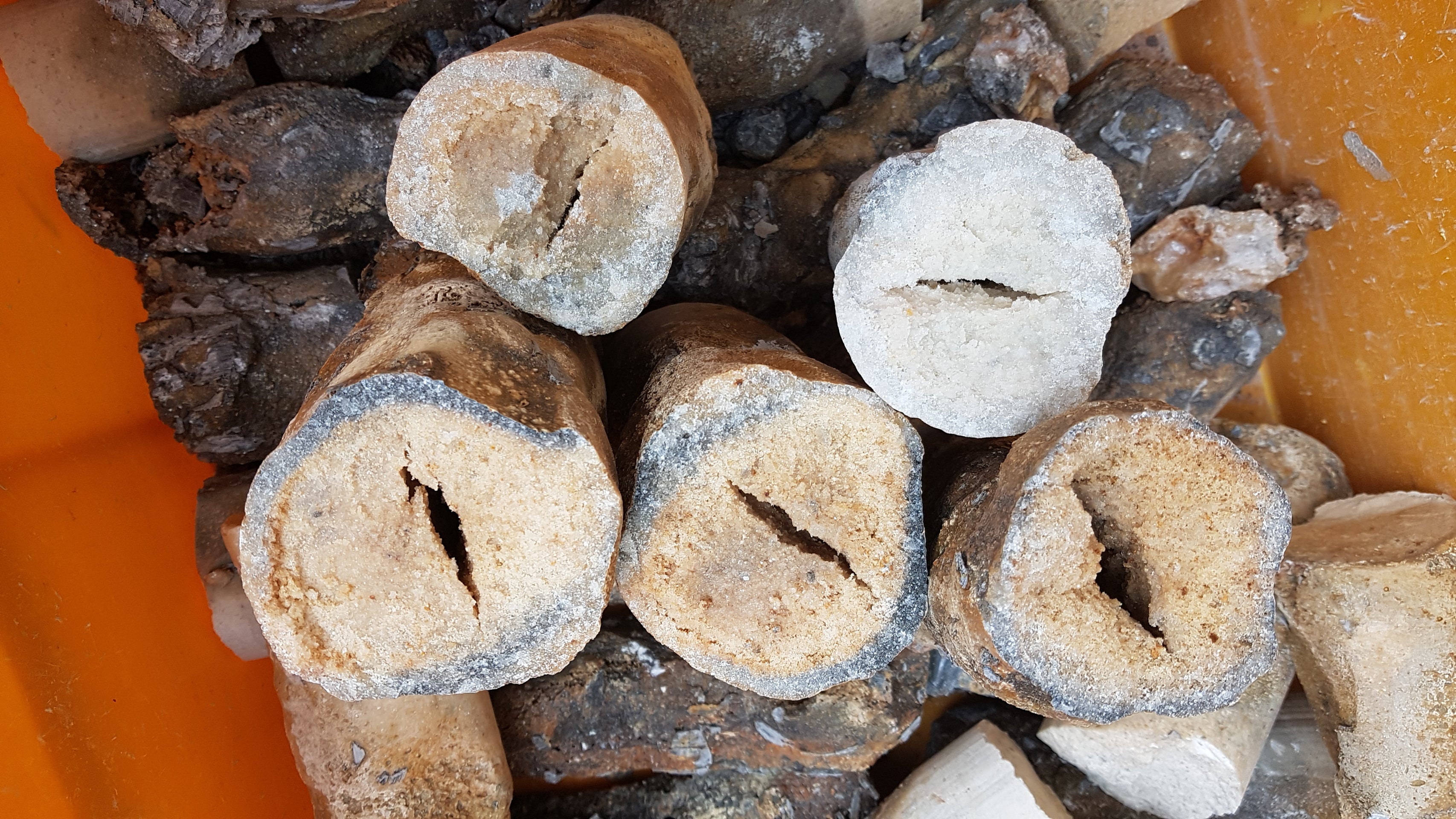 Coarse bamboo salt pieces, light and speckled stone chunks