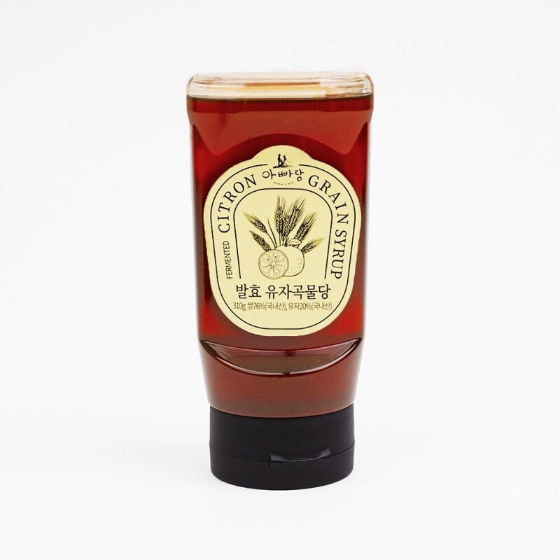 Squeezable citron grain syrup bottle with red label and cap, 11 oz net wt