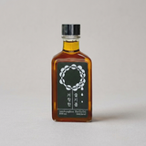 Amber glass perilla oil bottle with dark metal cap, 200 ml