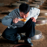 Fruit vinegar tasting: person drinking from a small cup