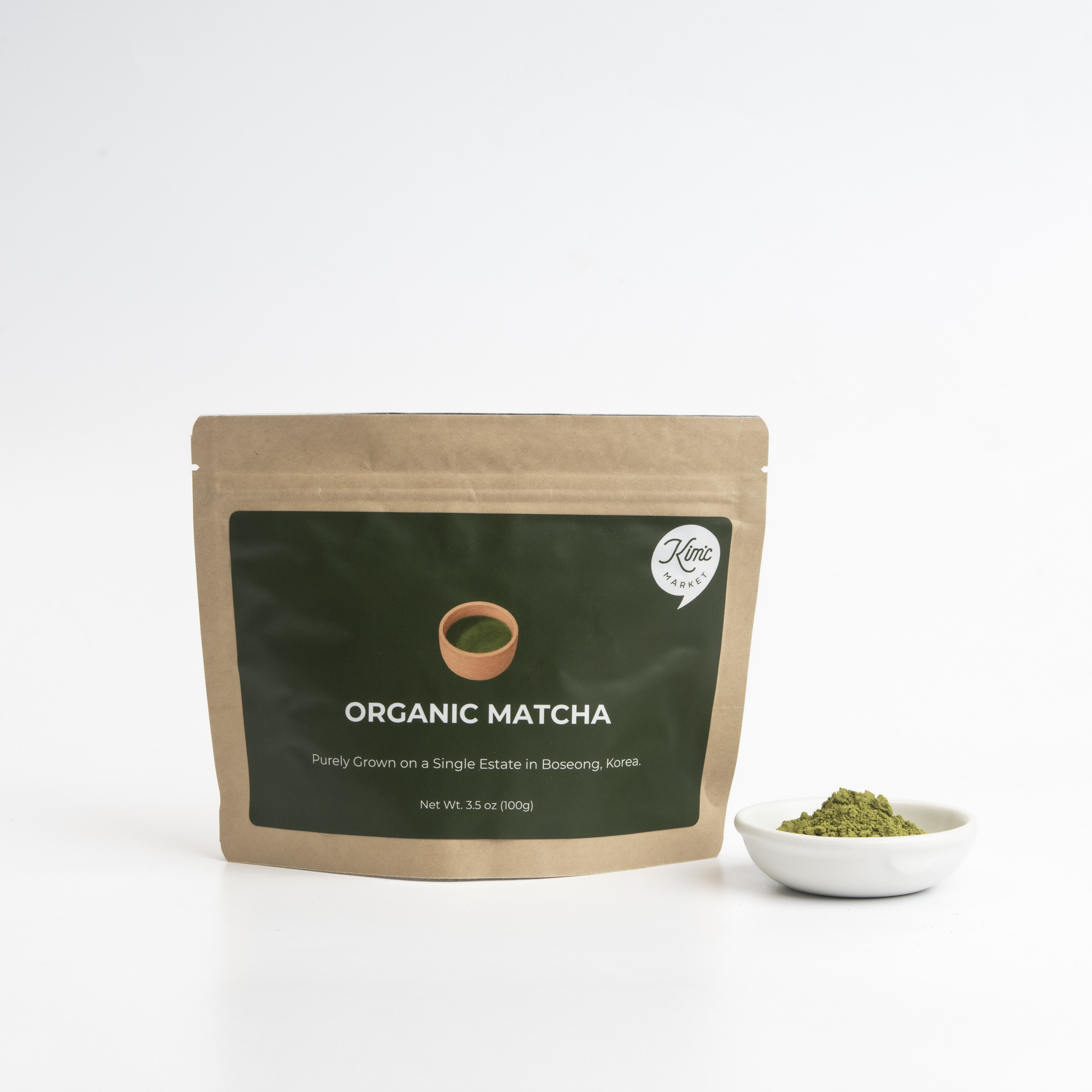 Matcha powder pouch with small bowl of finely ground green tea powder