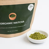 Matcha powder pouch with bowl of finely ground green tea powder