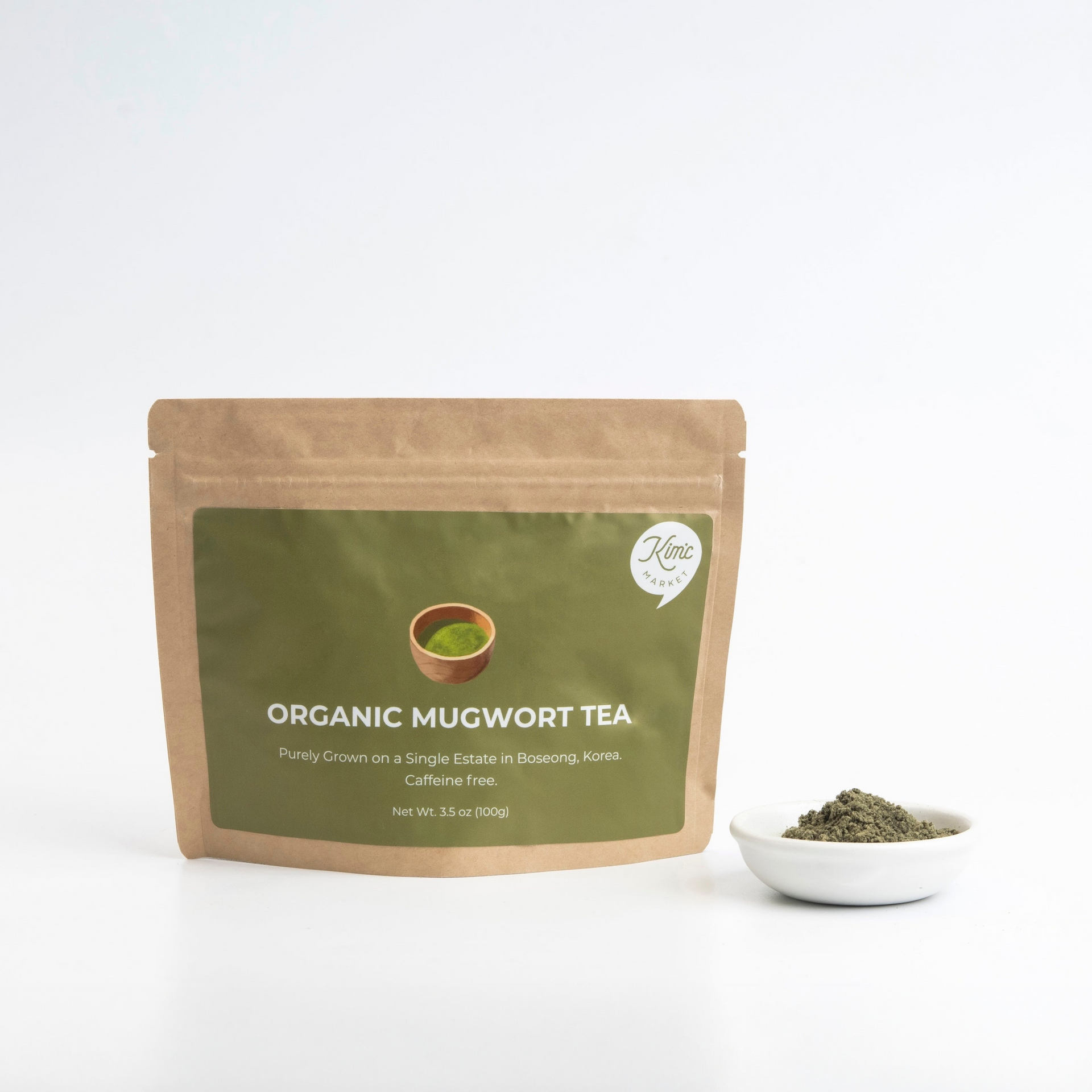 Organic mugwort powder (100 g) pouch with white bowl of dark green powder