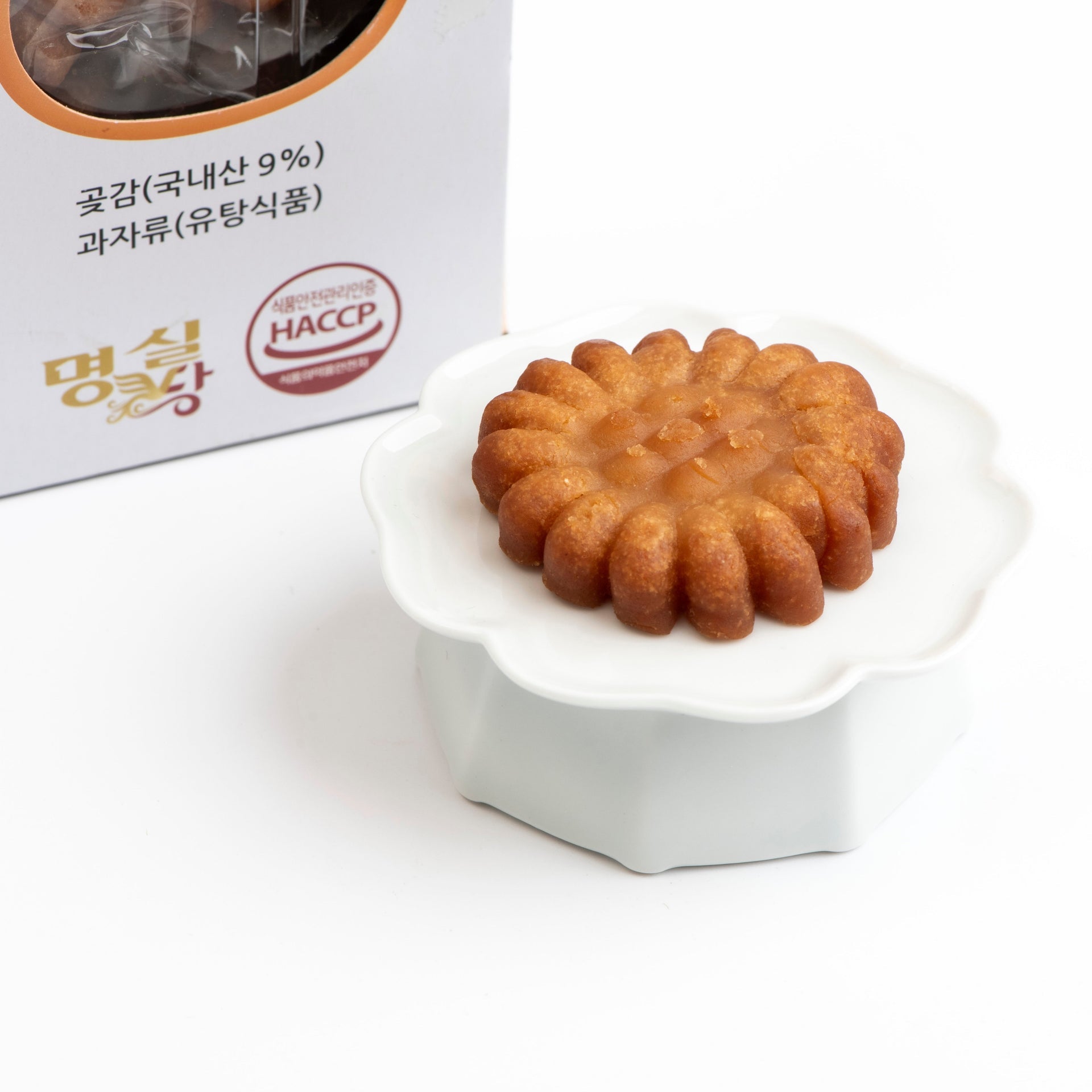 Brown ridged yakgwa cookie on white serving dish