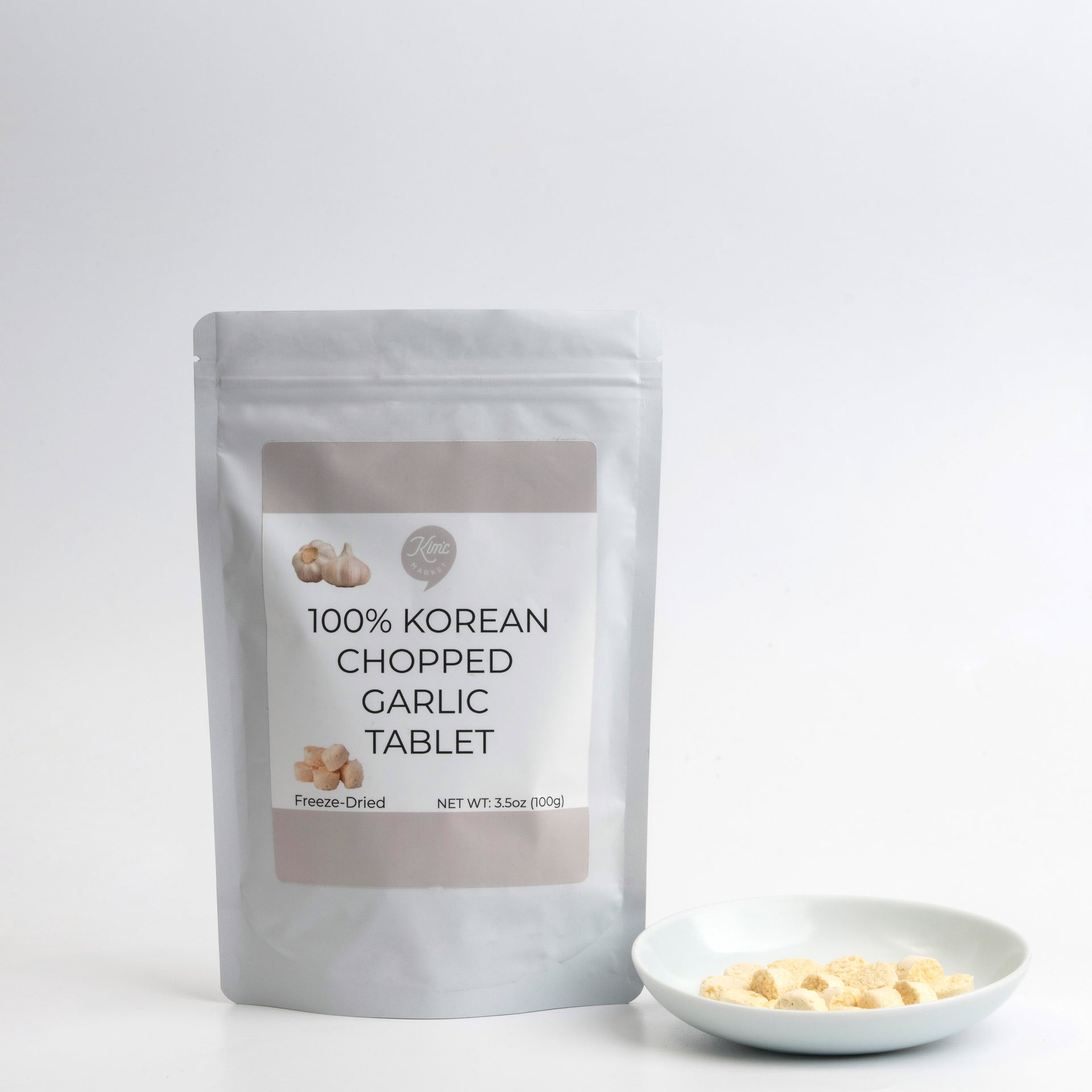 Freeze-dried chopped garlic tablets pouch with bowl of garlic tablets