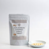 Freeze-dried chopped garlic tablets pouch with bowl of garlic tablets